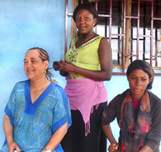 Rabbanit Bonita Sussman receives cornbraids for Shabbat. Photo by the Serge Etele