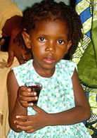 image: Little girl at Passover seder (photo by Serge Etele)