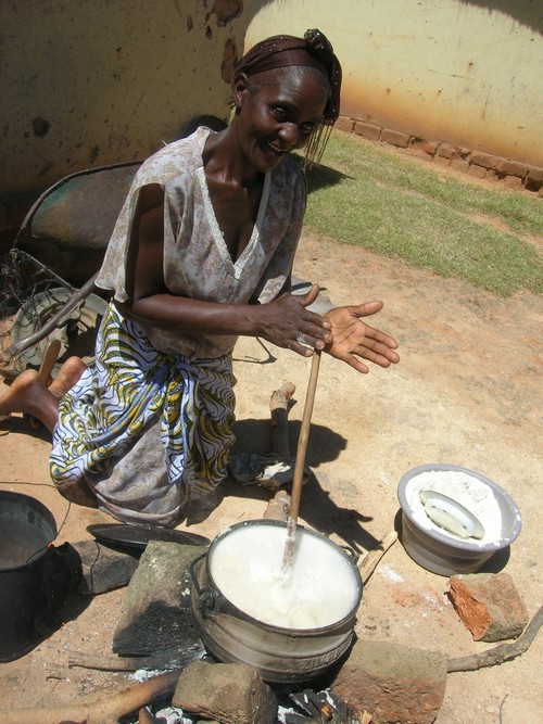 Lemba woman cooking over an open fire Photo by Sandy Leeder