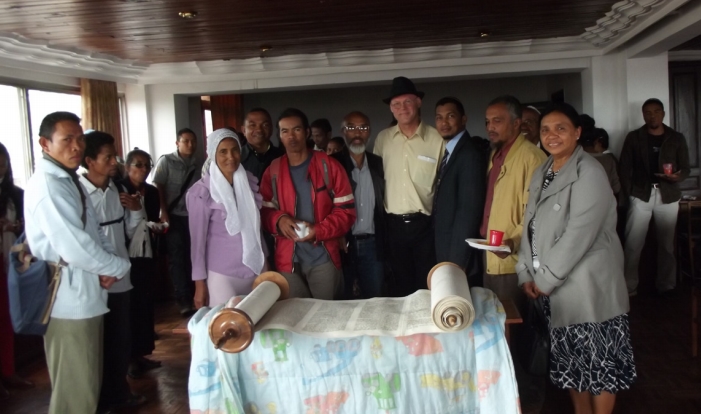 Torah Delivery. Peter Terry (Yakov Zamir) presents community leaders with a Torah from Kulanu (Photo courtesy of Peter Terry)