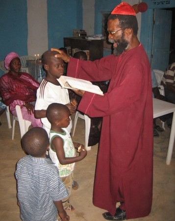 Sar Habakkuk blessing his children after Sabbath candle lighting Photo by William F.S. Miles
